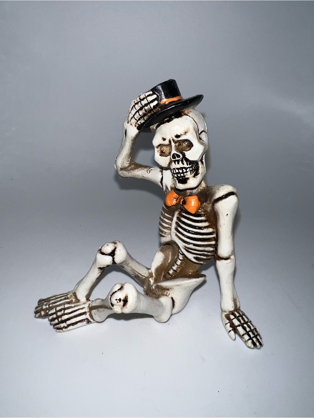 Halloween dapper sitting skeleton figurine